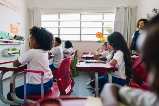 istock Girl student studying on classroom at school 1899822896