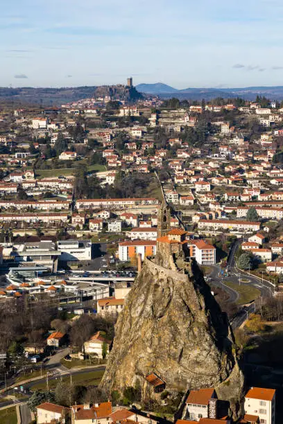 Photo of View of Polignac Castle and Saint-Michel Church in Aiguilhe on its rock from Rocher Corneille in Puy-en-Velay, Auvergne