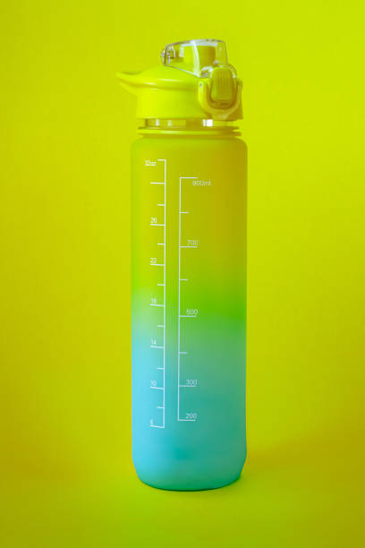 istock Colorful yellow reusable water bottle isolated 1899858593