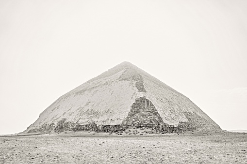 Saqqara, Egypt - January 2, 2024: The ancient Bent Pyramid of Dahshur for Pharaoh Snefru, near Cairo