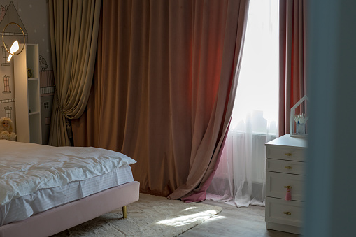 bedroom in delicate white pink and beige tones