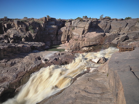 The Augrabies Falls is a waterfall on the Orange River, the largest river in South Africa. The falls set in a desolate and rugged milieu, is enclosed by the Augrabies Falls National Park