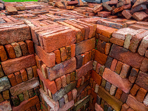 pile of red bricks in a building shop. selective focus