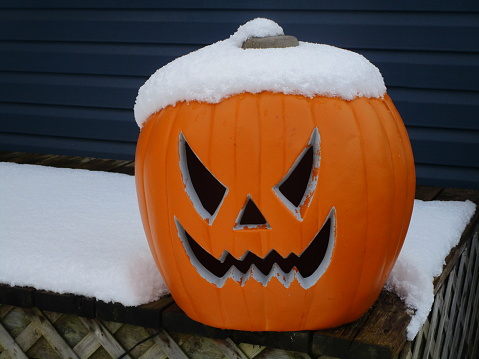 unseasonal snowfall on Halloween jack-o-lantern