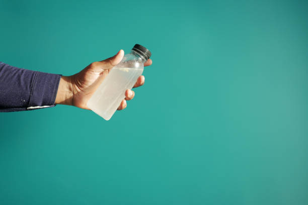 istock holding dirty bottle of water 1900173782