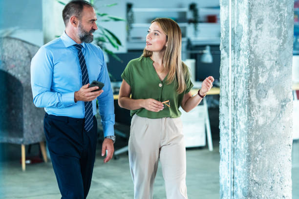 istock Business colleagues talking in the office 1900215798