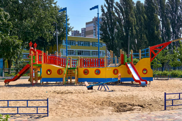 istock Summer spring children's playground with painted toy ship in park 1900277916