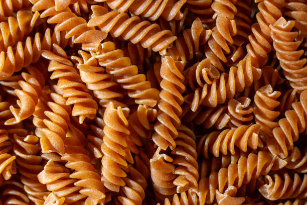 istock Uncooked Whole Grain Fusilli Pasta Background 1900311858
