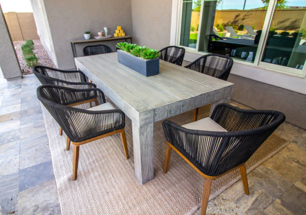 istock Back Patio Wooden Table With Six Rattan Chairs 1900336929