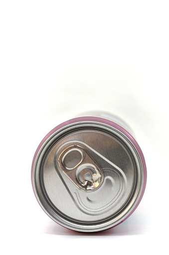 Close up view of the end of a ring pull drinks can lying on its side isolated on a white background