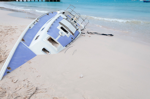 After extreme weather, a shipwrecked boat has washed ashore on to a beach in Barbados