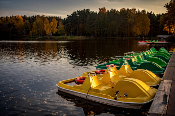 Old fashioned brightly colored pedal boats on Druskonis Lake in Druskininkai, Lithuania