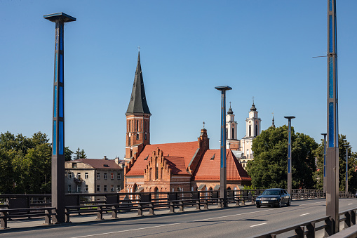 Kaunas, Lithuania - August 12, 2022:  Vytautas the Great church and Church of St. Francis Xavier in Kaunas old town.