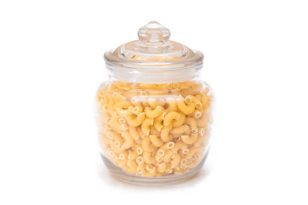 istock Uncooked Chifferi Rigati Pasta in Glass Jar Isolated on White 1900506705