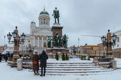 August, 2022. Helsinki, Finland. The main square of Helsinki in the old town on a winter day with some tourists - .