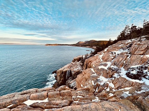 The Ocean Path Trail meanders along vast slabs of pink granite, picturesque cliffs, and breathtaking oceans views of the striking coast of Maine. The Ocean Path is a great way to access Thunder Hole and Otter Point from Sand Beach on a gradual hike. This picturesque hike is a great way to experience  Acadia National Park.