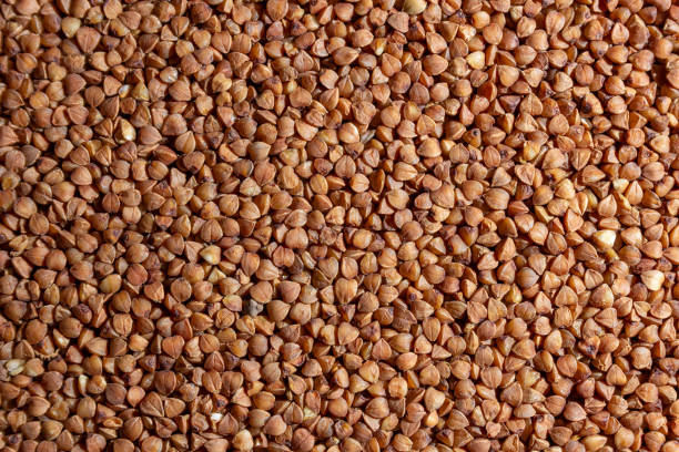 istock Dry Uncooked Brown Buckwheat Groats Background 1900567903