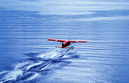 Alaskan float plane taking off from the Sitka, Alaska waterway.\n\nTaken in Sitka, Alaska