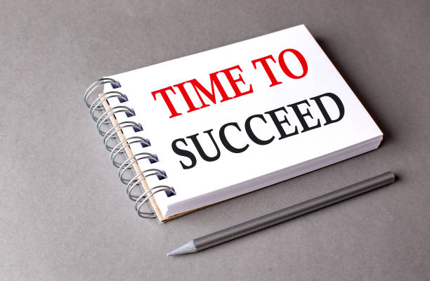 istock TIME TO SUCCEED word on notebook on grey background 1900634588