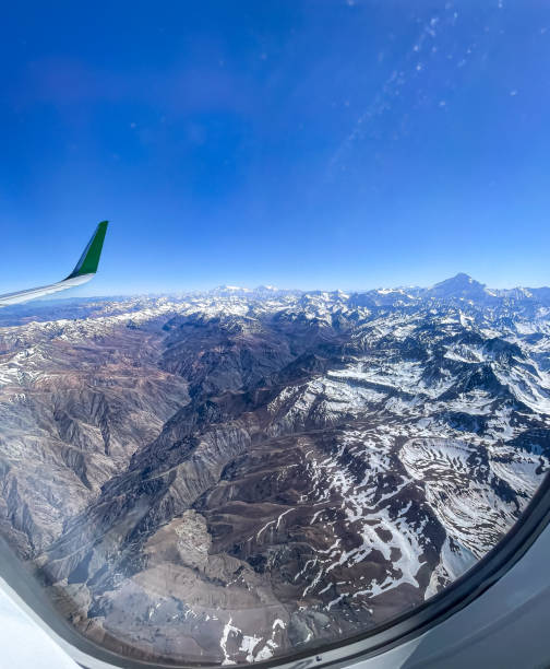 beautiful aerial view of the plane window of the andes mountains, cover with snow - argentina patagonia andes landscape стоковые фото и изображения