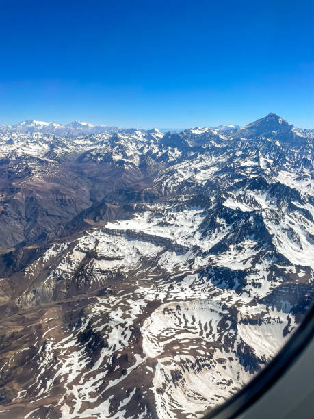 beautiful aerial view of the plane window of the andes mountains, cover with snow - argentina patagonia andes landscape стоковые фото и изображения