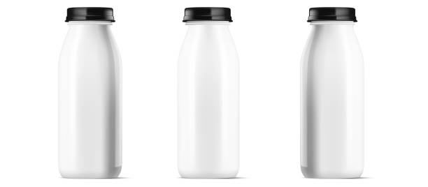 istock Trio of glossy white plastic bottles with black lids, uniform in design for dairy beverages. Vector illustration isolated on white, ready for branding. Vector illustration. 1900719569