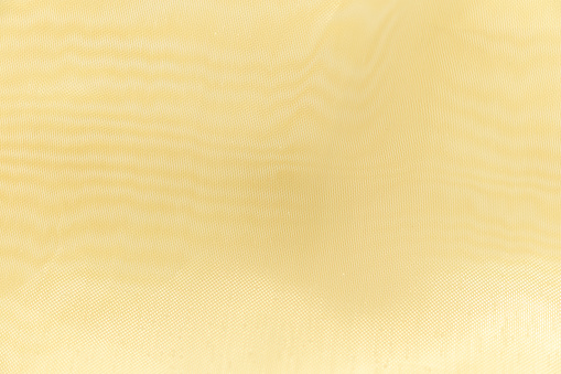Beige silk background with blank space.