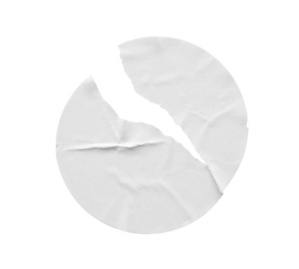 istock Blank white round torn paper sticker label isolated on white background 1900736671