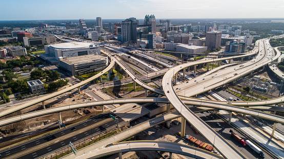 Aerial view of Downtown Orlando over the huge transport junction with highways, and multiple overpasses.