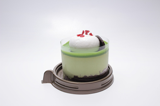 a Matcha green tea cake isolated on white background