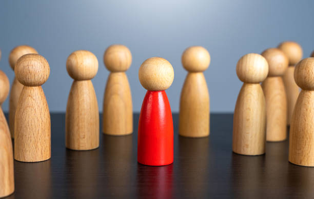 istock Standing out surrounded by a crowd. Stranger, eye-catching. Different, special. Infected carrying threat of spread of a pandemic. Collective immunity. Social distance. Intruder detection 1900824577