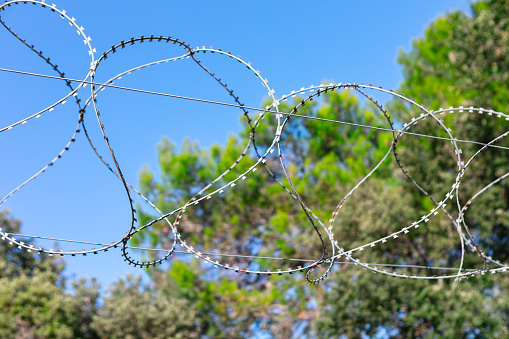 Barbed wire around the prison . The concept of security