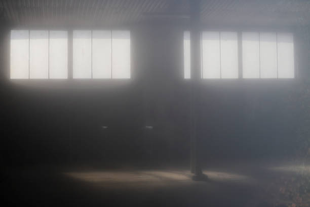 istock Sunrays in a retro foggy garage 1900834088