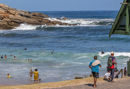 Aljezur, Portugal - October 3, 2020: People Surfing at Praia d'Arrifana Beach, surf paradise at Vicentine Coast, Algarve, Portugal