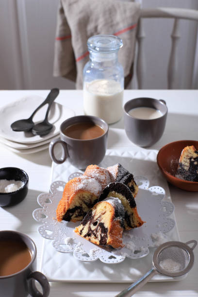 istock Marble Cake with Coffee with Powder Sugar and Kitchen Vintage Utensil, White Bakery Concept 1900921136