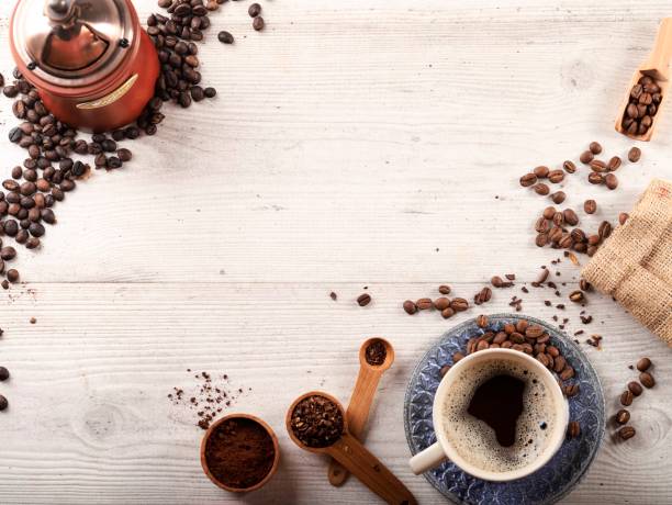 istock Espresso Coffee with Coffe Bean and Coarse Grinding Coffee, Copy Space for Text on White Wooden Background 1900956366