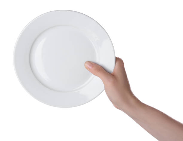 istock Woman holding clean ceramic plate isolated on white, closeup 1900986180