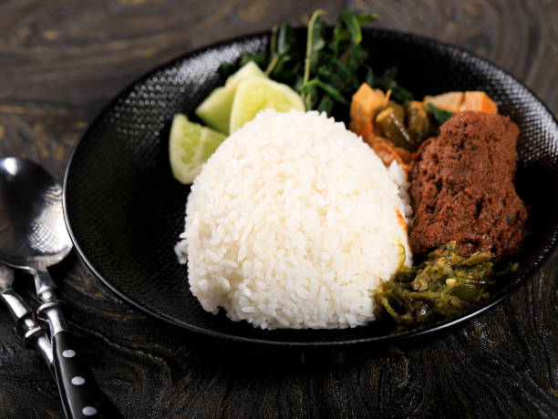 Nasi Padang with Rendang on Black Plate stock photo