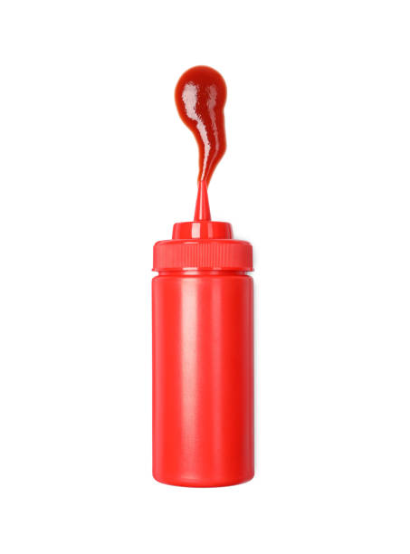 istock Squeezed ketchup from red bottle isolated on white, top view 1901011008