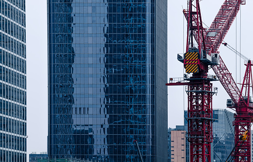 Construction tower cranes on a building site
