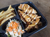 Serving Of  Bento Box With Chicken Fillet, French Fries, Tartar Sauce And Pickle. Food Menu.