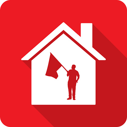 Vector illustration of a house with man holding flag against a red background in flat style.