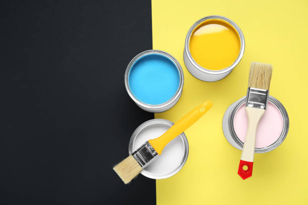 istock Cans of different paints and brushes on color background, flat lay. Space for text 1901092211
