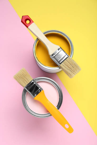 istock Cans of different paints with brushes on color background, flat lay 1901093760