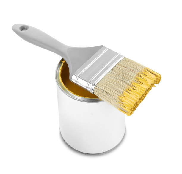 istock Can of yellow paint with brush isolated on white 1901094801