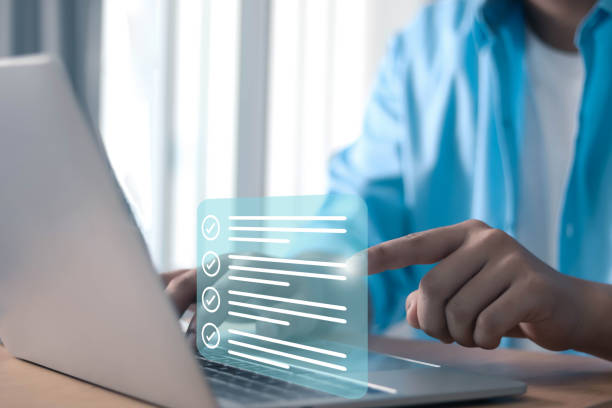 istock Businessman showing check mark summarizing job Compile lists, votes, and to-do lists. Checklists, task lists, and summaries description checklist Documents and online quality assessment standards 1901103061