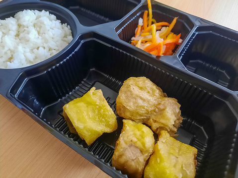 Serving Of Bento Box With Special Rice, Salad, Ekkado And Egg Chicken Roll. Food Menu.