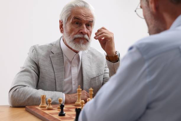 istock Men playing chess during tournament at table 1901254583
