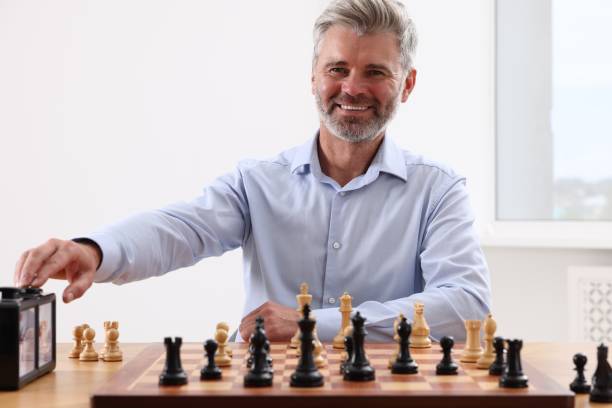 istock Man turning on chess clock during tournament at table indoors 1901254604