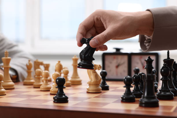 istock Man playing chess during tournament at chessboard, closeup 1901255116